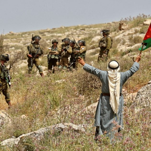Members of Israeli security forces deploy as Palestinians demonstrate against the establishment of Israeli outposts on their lands, in Beit Dajan east of Nablus in the occupied West Bank, on April 29, 2022. (Photo by JAAFAR ASHTIYEH / AFP)