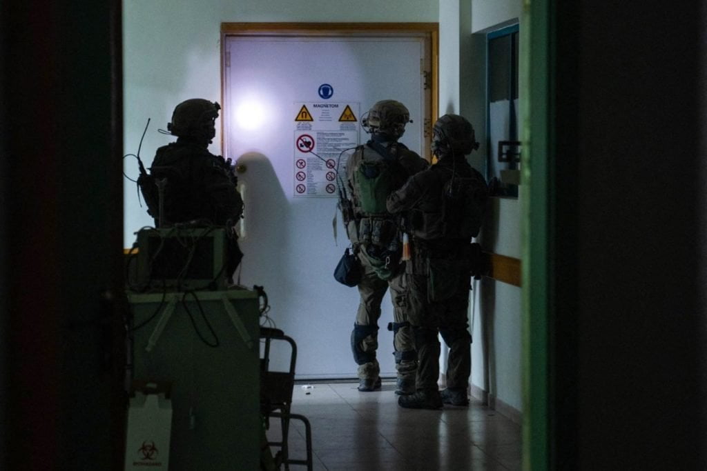 This handout picture released by the Israeli army on November 15, 2023, reportedly shows Israeli soldiers carrying out operations inside Al-Shifa hospital in Gaza City, amid continuing battles betweeen Israel and the Palestinian militant group Hamas. (Photo by Israeli Army / AFP) / RESTRICTED TO EDITORIAL USE - MANDATORY CREDIT "AFP PHOTO / ISRAELI ARMY " - NO MARKETING NO ADVERTISING CAMPAIGNS - DISTRIBUTED AS A SERVICE TO CLIENTS - RESTRICTED TO EDITORIAL USE - MANDATORY CREDIT "AFP PHOTO / ISRAELI ARMY " - NO MARKETING NO ADVERTISING CAMPAIGNS - DISTRIBUTED AS A SERVICE TO CLIENTS /