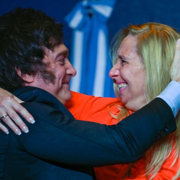 Argentine presidential candidate for the La Libertad Avanza alliance Javier Milei (L) celebrates with his sister Karina Milei after winning the presidential election runoff at his party headquarters in Buenos Aires on November 19, 2023. - Libertarian outsider Javier Milei pulled off a massive upset Sunday with a resounding win in Argentina's presidential election, a stinging rebuke of the traditional parties that have overseen decades of economic decline. (Photo by LUIS ROBAYO / AFP)