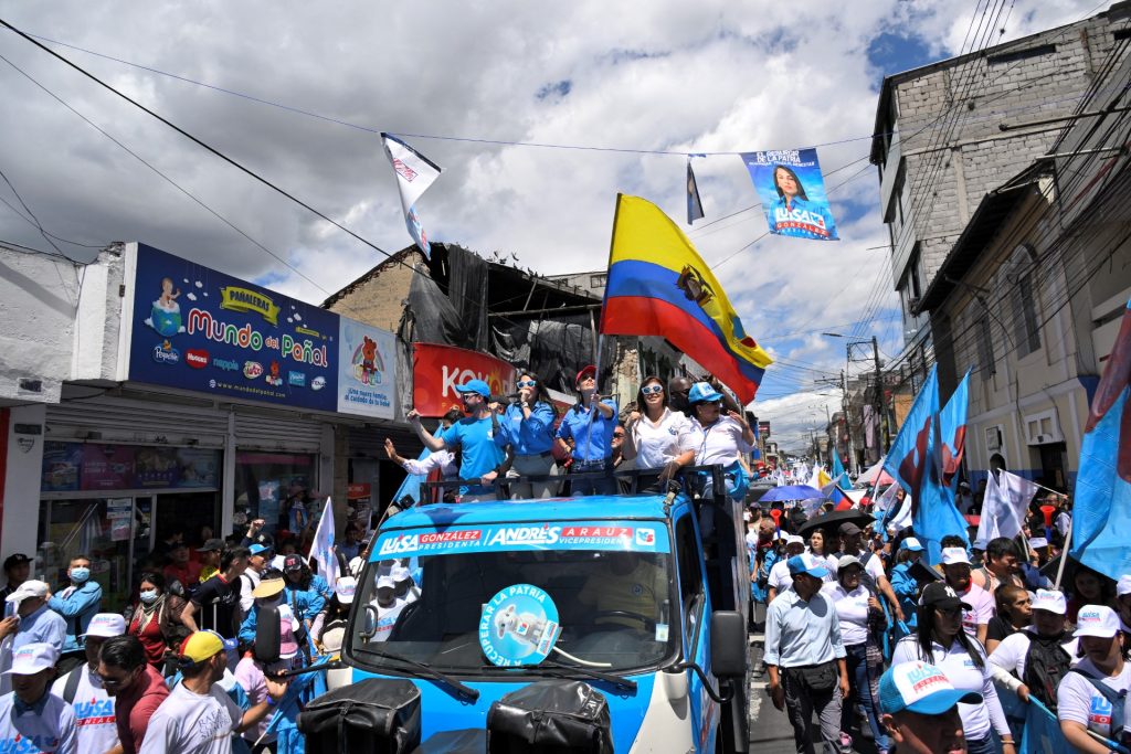 Ecuador's presidential candidate for the Revolucion Ciudadana party, Luisa Gonzalez, greets supporters during a caravan in northern Quito on July 10, 2023. Ecuador's President Guillermo Lasso called for snap elections for August 20 after he dissolved Congress in May to avoid an impeachment trial for allegedly allowing corruption in state-owned companies. (Photo by Rodrigo BUENDIA / AFP)
