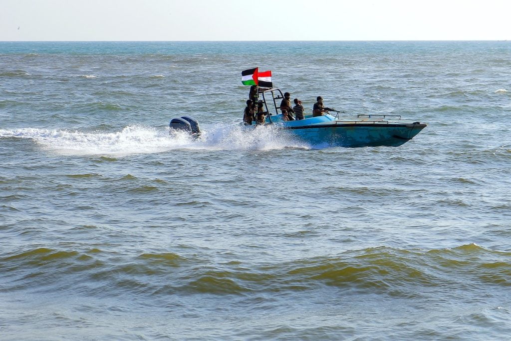 (FILES) Members of the Yemeni Coast Guard affiliated with the Huthi group patrol the sea as demonstrators marched through the Red Sea port city of Hodeida in solidarity with the people of Gaza on January 4, 2024, amid the ongoing battles between Israel and the militant Hamas group in Gaza. - Heavy air strikes pounded rebel-held cities in Yemen early on January 12, 2024, according to the Huthi rebels' official media and AFP correspondents. The capital Sanaa, Hodeida and Saada were all targeted, the Huthis' official media said, blaming "American aggression with British participation". (Photo by AFP)