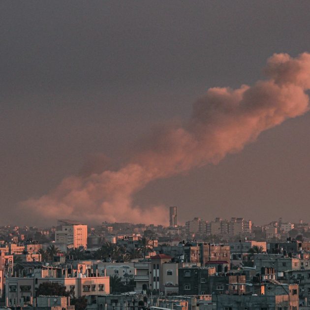 A picture taken from Rafah in the southern Gaza Strip shows smoke rising over buildings in Khan Yunis following Israeli bombardment on February 5, 2024, as fighting continues between Israel and the Palestinian Hamas group. (Photo by Said KHATIB / AFP)