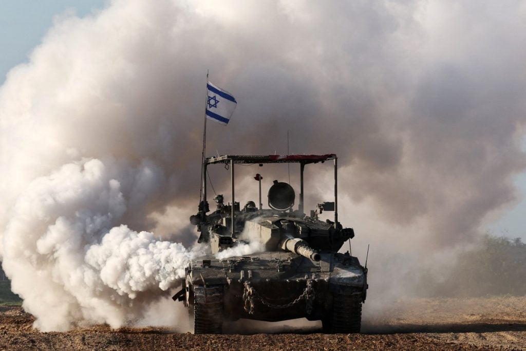 An Israeli army tank rolls in southern Israel along the border with the Gaza Strip on January 24, 2024, amid ongoing battles between Israel and the Palestinian militant group Hamas. (Photo by JACK GUEZ / AFP)