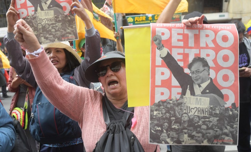 A woman shouts slogans during a rally in support of Colombian President Gustavo Petro in Bogota on February 8, 2024. (Photo by Daniel Munoz / AFP)