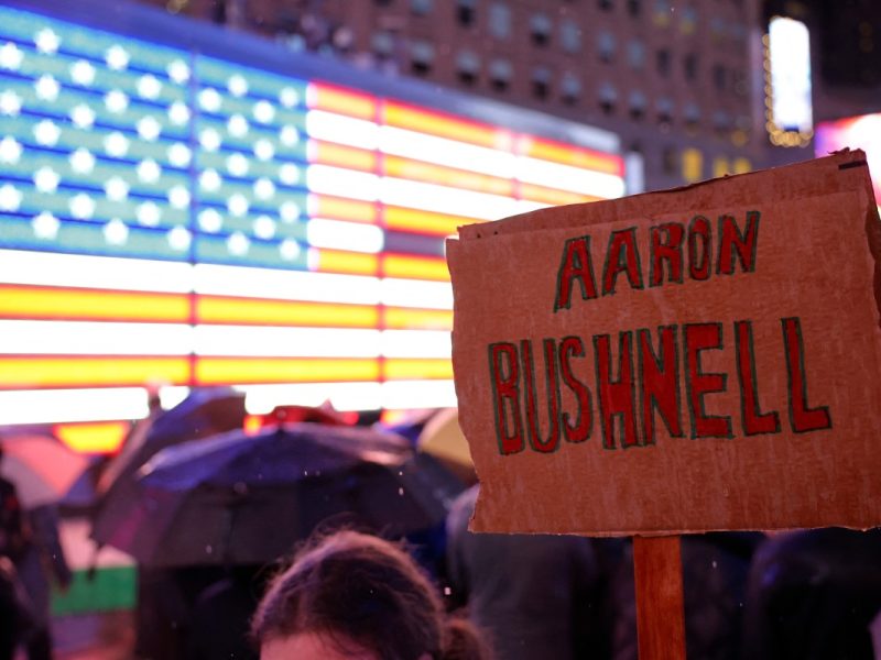 NEW YORK, NEW YORK - FEBRUARY 27: A person holds a sign at a vigil for U.S. Airman Aaron Bushnell at the US Army Recruiting Office in Times Square on February 27, 2024 in New York City. Bushnell died after setting himself on fire outside the Israeli Embassy in Washington, DC on Sunday. In a video that was posted to a social media account showing the act, he stated that would no longer be complicit in genocide," before pouring an unknown liquid over himself and igniting it while yelling Free Palestine repeatedly. Michael M. Santiago/Getty Images/AFP (Photo by Michael M. Santiago / GETTY IMAGES NORTH AMERICA / Getty Images via AFP)