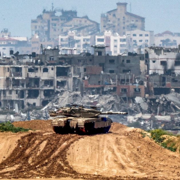 This picture taken from Israel's southern border with the Gaza Strip shows Israeli army battle tank at a position along the border with the Palestinian territory on March 19, 2024, amid the ongoing conflict between Israel and the militant group Hamas. (Photo by JACK GUEZ / AFP)