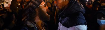 A Trump supporter clashes with a demonstrator at Black Lives Matter plaza across from the White House on election night in Washington, DC on November 3, 2020. (Photo by Olivier DOULIERY / AFP)