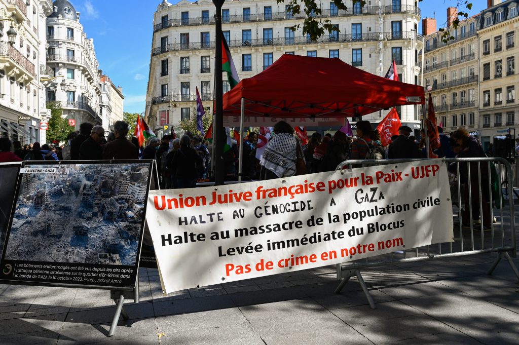 A banner with writing on it FRENCH JEWISH UNION FOR PEACE UJFP is hung on a barricade during a gathering in support of the Palestinian people, in Lyon, France, September 14, 2024. (Photo by Matthieu Delaty / Hans Lucas via AFP)
