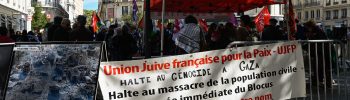 A banner with writing on it FRENCH JEWISH UNION FOR PEACE UJFP is hung on a barricade during a gathering in support of the Palestinian people, in Lyon, France, September 14, 2024. (Photo by Matthieu Delaty / Hans Lucas via AFP)