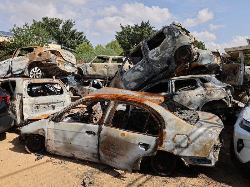 A picture taken on October 17, 2023 shows a pile of damaged and burnt vehicles in the southern Israeli city of Sderot, following the October 7 attack by Gaza-based Hamas militants. US President Joe Biden will visit Israel on October 18, in a show of "ironclad" support as Washington tries to prevent the escalating Gaza war against Hamas from spilling over into a regional conflict. (Photo by Jack Guez / AFP)
