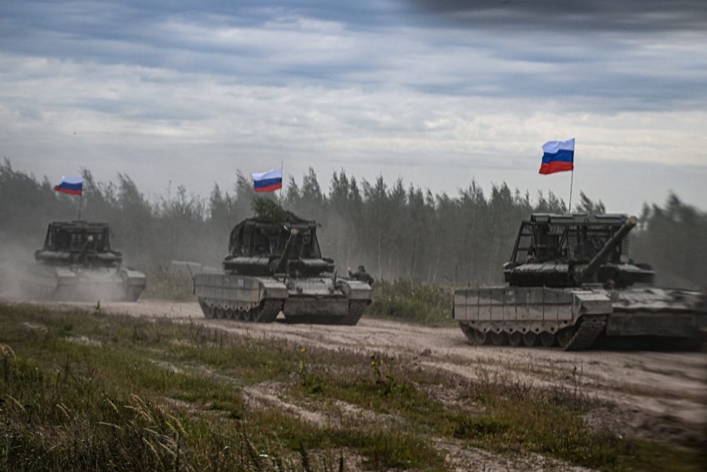 Russian tanks move during the "Zapad-2025" (West-2025) joint Russian-Belarusian military drills at a training ground near the town of Borisov, east of the capital Minsk, on September 15, 2025. (Photo by Olesya KURPYAYEVA / AFP)