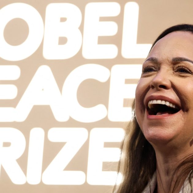 Nobel peace prize laureate Maria Corina Machado laughs as she addresses a press conference at the Grand Hotel in Oslo, Norway, on December 11, 2025. The 58-year-old, who has been in hiding in her home country since June 2024, missed the award of the Nobel Prize in Oslo on December 10. But she waved to supporters from her hotel shortly after arriving during the night. Maria Corina Machado is the lynchpin of opposition to Venezuelan President Nicolas Maduro's regime, a fearless activist with rock star appeal whose inability to attend her own Nobel prize ceremony underlined the dangers she faces. (Photo by Odd ANDERSEN / AFP)