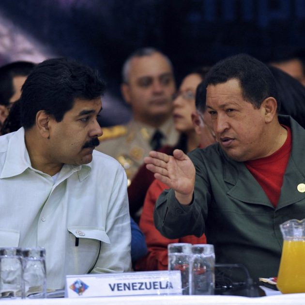 (FILES) Venezuela's President Hugo Chavez (R) talks with his Foreign Affairs Minister Nicolas Maduro during the closing ceremony of the Climate Summit in Tiquipaya 12 km from Cochabamba, Bolivia on April 22, 2010. President Donald Trump said on January 3, 2026, that US forces had captured Venezuelan leader Nicolas Maduro after launching a "large scale strike" on the South American country. "The United States of America has successfully carried out a large scale strike against Venezuela and its leader, President Nicolas Maduro, who has been, along with his wife, captured and flown out of the Country," Trump said on Truth Social. (Photo by AIZAR RALDES / AFP)