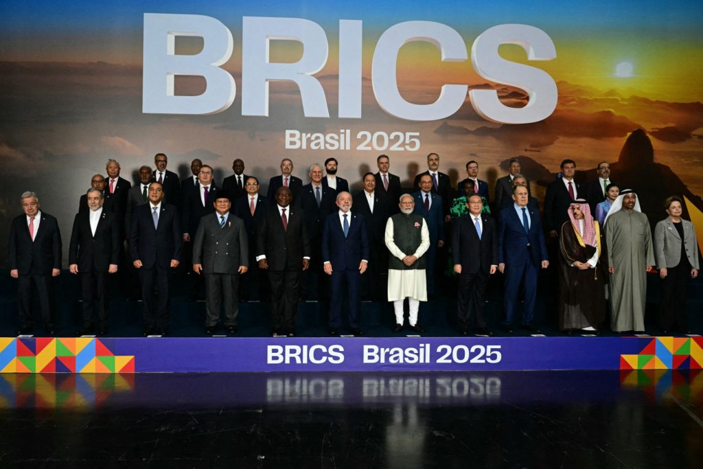Heads of state and government of member, partner, and external engagement countries pose for a family photo during the BRICS summit in Rio de Janeiro, Brazil, on July 7, 2025. BRICS leaders at a summit on Sunday took aim at US President Donald Trump's "indiscriminate" import tariffs and recent Israeli-US strikes on Iran. (Photo by Pablo PORCIUNCULA / AFP)