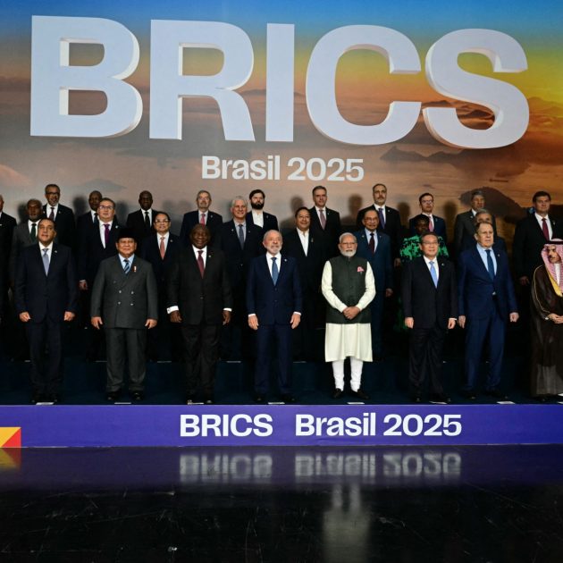 Heads of state and government of member, partner, and external engagement countries pose for a family photo during the BRICS summit in Rio de Janeiro, Brazil, on July 7, 2025. BRICS leaders at a summit on Sunday took aim at US President Donald Trump's "indiscriminate" import tariffs and recent Israeli-US strikes on Iran. (Photo by Pablo PORCIUNCULA / AFP)
