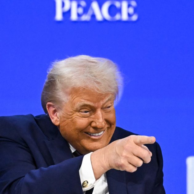 US President Donald Trump gestures as he speaks at the "Board of Peace" meeting during the World Economic Forum (WEF) annual meeting in Davos on January 22, 2026. US President Donald Trump will show off his new "Board of Peace" at Davos on January 22, 2026 burnishing his claim to be a peacemaker a day after backing off his own threats against Greenland. Originally meant to oversee the rebuilding of Gaza after the war between Hamas and Israel, the board's charter does not limit its role to the Strip, and has sparked concerns that Trump wants it to rival the United Nations. (Photo by Fabrice COFFRINI / AFP)