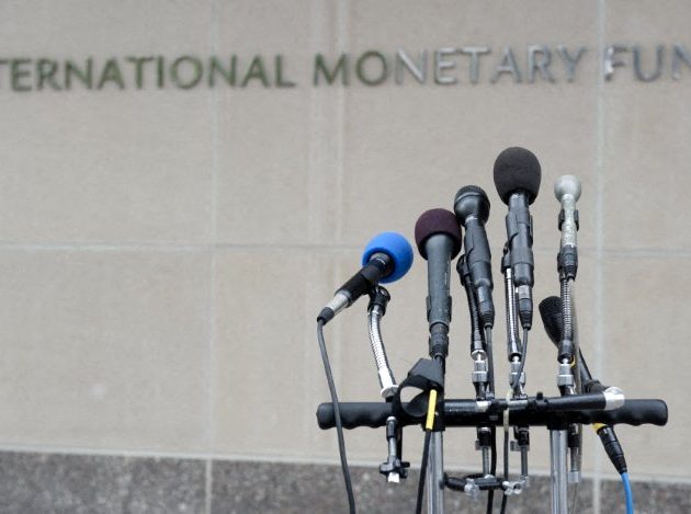 A microphone stand sits in front of International Monetary Fund (IMF) Headquarters in Washington, DC, May 16, 2011 in preparation for a statement to the press. The organization's director, Dominique Strauss-Kahn, faced arraignment in New York earlier Monday on allegations of sexual assault. AFP PHOTO / Saul LOEB (Photo by SAUL LOEB / AFP)