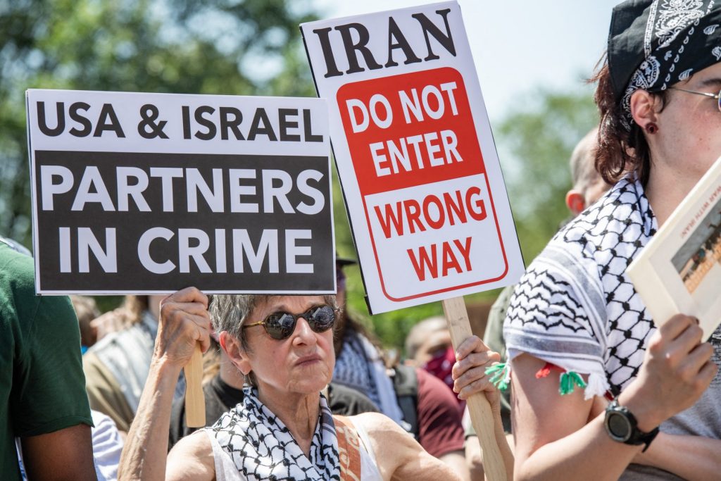 People take part in an anti-war demonstration in Boston, Massachusetts, on June 22, 2025, protesting US strikes on Iranian nuclear sites. The surprise US strikes on June 21 threaten to deepen conflict in the Middle East after Israel launched a bombing campaign against Iran, with Tehran vowing to retaliate against US involvement. (Photo by Joseph Prezioso / AFP)