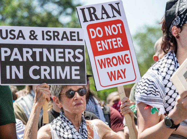 People take part in an anti-war demonstration in Boston, Massachusetts, on June 22, 2025, protesting US strikes on Iranian nuclear sites. The surprise US strikes on June 21 threaten to deepen conflict in the Middle East after Israel launched a bombing campaign against Iran, with Tehran vowing to retaliate against US involvement. (Photo by Joseph Prezioso / AFP)