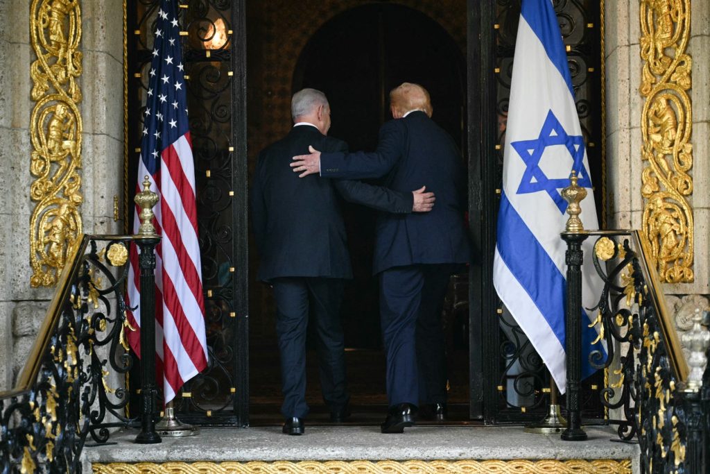 US President Donald Trump (R) and Israeli Prime Minister Benjamin Netanyahu (L) walk inside after Netanyahu arrived at Trumps Mar-a-Lago residence in Palm Beach, Florida, on December 29, 2025. (Photo by Jim WATSON / AFP)