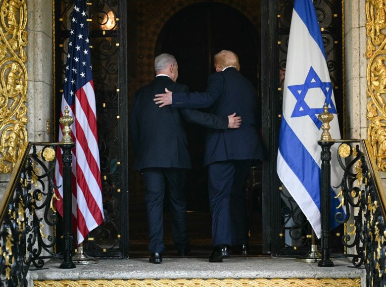 US President Donald Trump (R) and Israeli Prime Minister Benjamin Netanyahu (L) walk inside after Netanyahu arrived at Trumps Mar-a-Lago residence in Palm Beach, Florida, on December 29, 2025. (Photo by Jim WATSON / AFP)