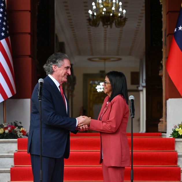 Venezuelas interim president, Delcy Rodriguez, shakes hands with US Interior Secretary Doug Burgum after their meeting at the Miraflores Presidential Palace in Caracas on March 4, 2026. US Interior Secretary Doug Burgum on March 4, 2026, became the latest senior Trump administration official to visit Venezuela, as Washington pushes to ramp up oil and mineral production in the country. (Photo by Federico PARRA / AFP)