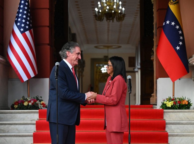 Venezuelas interim president, Delcy Rodriguez, shakes hands with US Interior Secretary Doug Burgum after their meeting at the Miraflores Presidential Palace in Caracas on March 4, 2026. US Interior Secretary Doug Burgum on March 4, 2026, became the latest senior Trump administration official to visit Venezuela, as Washington pushes to ramp up oil and mineral production in the country. (Photo by Federico PARRA / AFP)