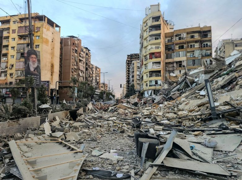A photograph shows a portrait of Irans slain supreme leader Ayatollah Ali Khamenei and the rubble of a destroyed building at the site of an overnight Israeli airstrike in Beiruts southern suburbs on March 28, 2026. Israel's military renewed its attacks on Beirut's southern suburbs on March 27, saying it was targeting Hezbollah infrastructure, as the Iran-backed group said the foes had clashed directly in the country's south. (Photo by AFP) /