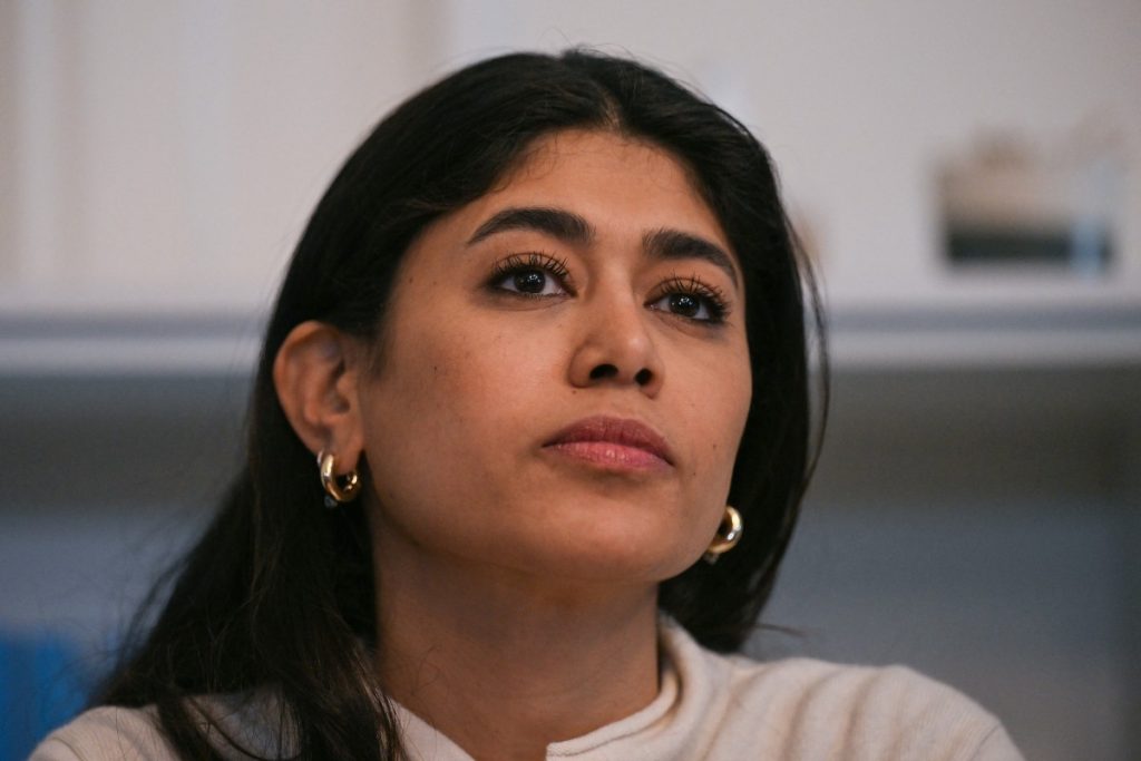 French-Palestinian member of the European Parliament Rima Hassan looks on during a press conference with her lawyer following a hearing at the regional headquarters of the judiciary police in Paris, France, on April 3, 2026. La France Insoumise (LFI) MEP Rima Hassan was again questioned by judicial police on April 3, 2026, as part of an investigation separate from the suspicion of "glorification of terrorism" for which she was placed in police custody the day before. During a search of her belongings on April 2, 2026, "the presence of substances resembling CBD on the one hand and 3MMC (a synthetic drug) on the other, about which she was questioned" was discovered, the prosecutor's office said at the end of her police custody, adding that "these elements were separate and will be subject to a distinct procedure". (Photo by Blanca CRUZ / AFP)