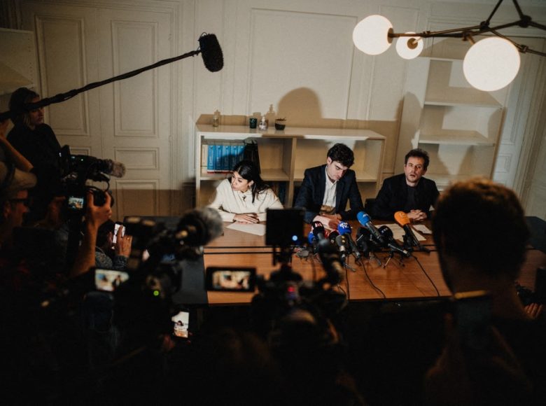 Flash photo of Rima Hassan European deputy and member of the political party La France Insoumise LFI speaking alongside her lawyer Vincent Brengarth during a press conference held by Rima Hassan European deputy and member of the political party La France Insoumise LFI with her lawyer following a hearing at the regional headquarters of the judiciary police of Paris in Paris France on April 3, 2026. (Photo by Bastien Ohier / Hans Lucas via AFP)