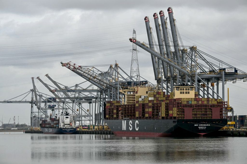 An MSC operated container ship is docked in a harbour basin in Europe's second-largest port of Antwerp, northern Belgium, where shipping is largely halted following an oil spill at one of its docks, on April 10, 2026. A port statement said the spill occurred during a "bunkering operation", the process of filling a ship with fuel, in the Deurganck Dock and was "causing significant disruption" to shipping. Deurganck is one of the port's most important container docks, used by some of the largest ships in the world to load and unload goods. (Photo by NICOLAS TUCAT / AFP)