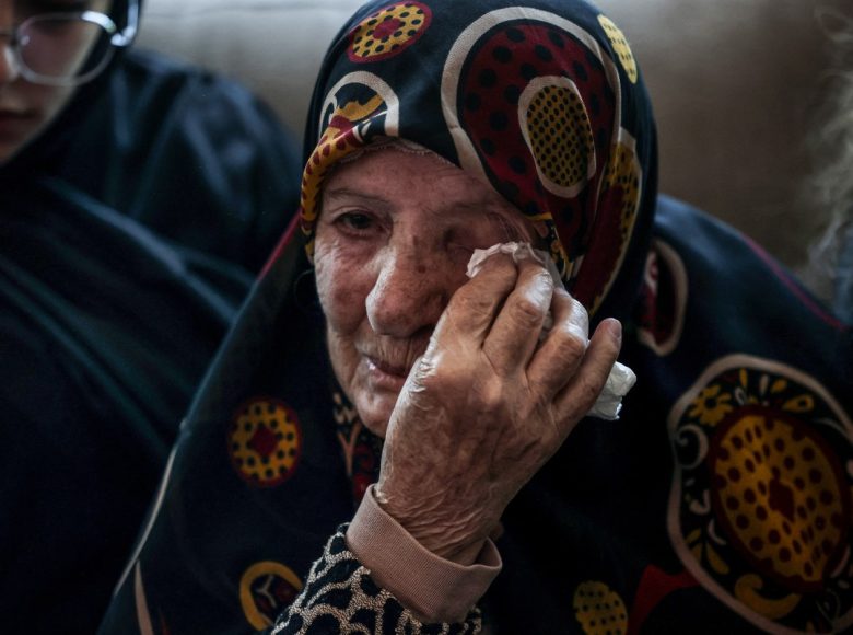 A relative of Hassan Ali Badawi, a paramedic with the Lebanese Red Cross who was killed the previous day in an Israeli airstrike, mourns as the family receives condolences at their home in the Bchamoun area south of Beirut, on April 13, 2026. Lebanon's health ministry said at least six people were killed on April 12 in the south, including a Red Cross paramedic, after "the Israeli enemy directly targeted a Lebanese Red Cross ambulance team". (Photo by Anwar AMRO / AFP)