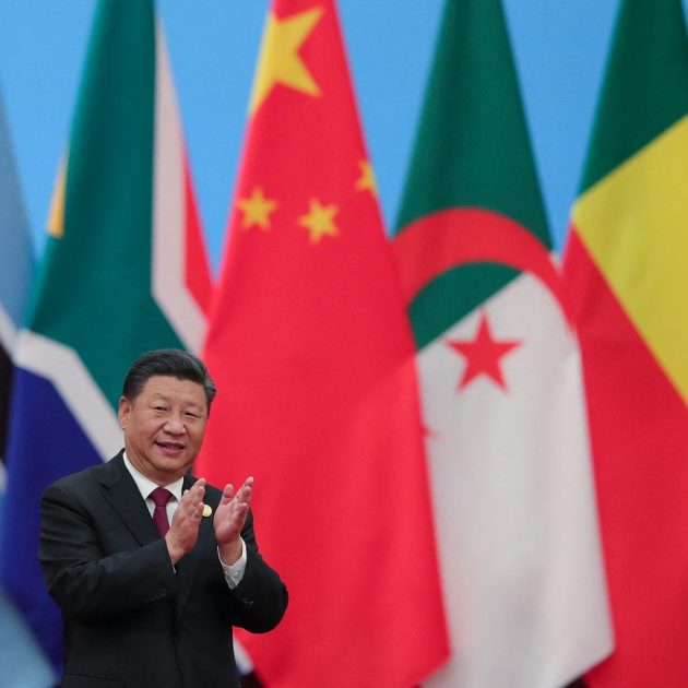 China's President Xi Jinping applauding as he attends the Forum On China-Africa Cooperation - Round Table Conference at the Great Hall of the People in Beijing on September 4, 2018. (Photo by Lintao Zhang / POOL / AFP)