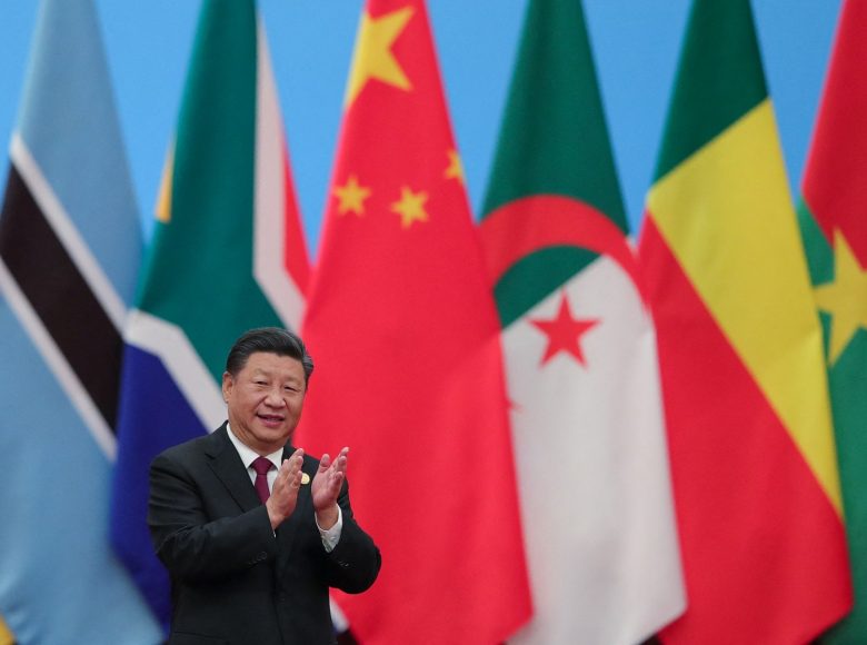 China's President Xi Jinping applauding as he attends the Forum On China-Africa Cooperation - Round Table Conference at the Great Hall of the People in Beijing on September 4, 2018. (Photo by Lintao Zhang / POOL / AFP)