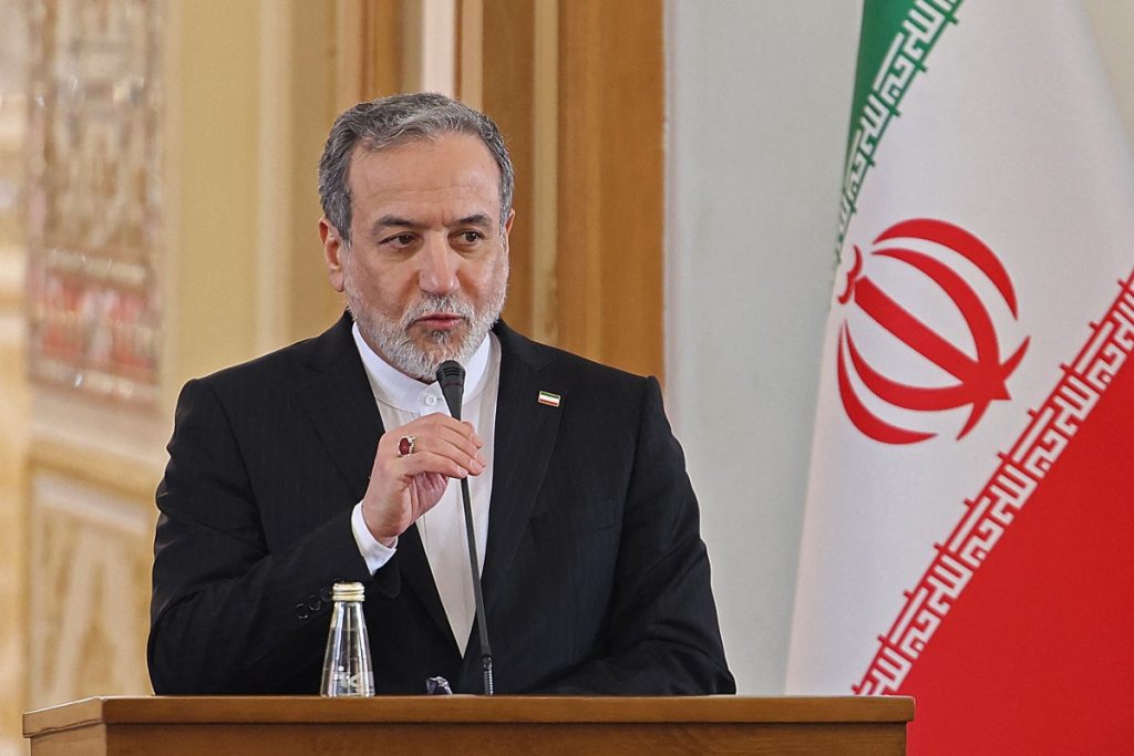 Iranian Foreign Minister Abbas Araghchi attends a joint press conference with his Iraqi counterpart Fuad Hussein, in Tehran on January 18, 2026. (Photo by ATTA KENARE / AFP)
