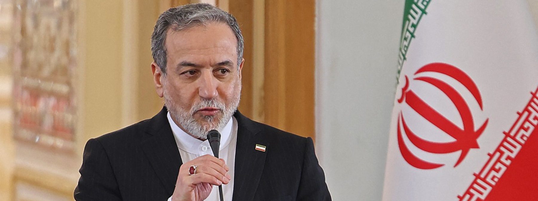 Iranian Foreign Minister Abbas Araghchi attends a joint press conference with his Iraqi counterpart Fuad Hussein, in Tehran on January 18, 2026. (Photo by ATTA KENARE / AFP)
