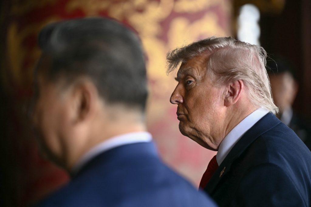 China's President Xi Jinping (L) and US President Donald Trump visit the Temple of Heaven in Beijing on May 14, 2026. Xi warned Trump that the issue of Taiwan could push their two countries into "conflict" if mishandled, a stark opening salvo as a superpower summit set to tackle numerous thorny issues began in Beijing on May 14. (Photo by Brendan SMIALOWSKI / POOL / AFP)
