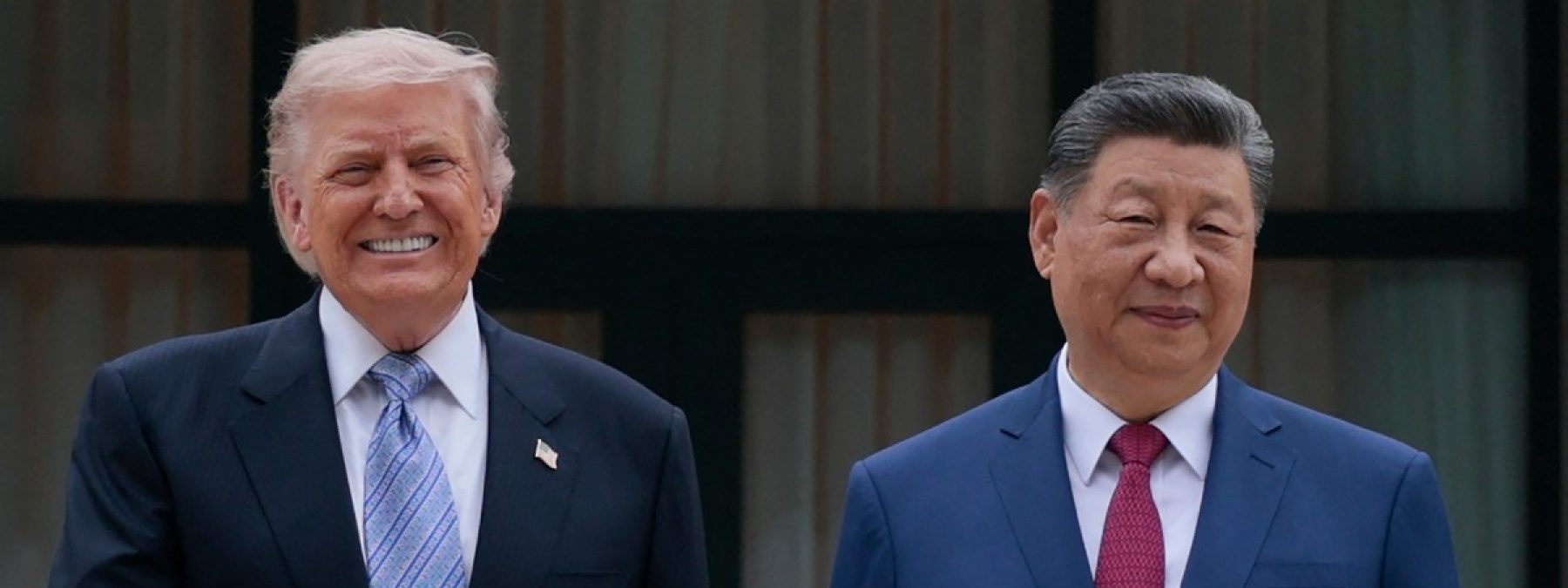 US President Donald Trump (L) poses for photos with Chinas President Xi Jinping during a visit to Zhongnanhai Garden in Beijing on May 15, 2026. (Photo by Evan Vucci / POOL / AFP)