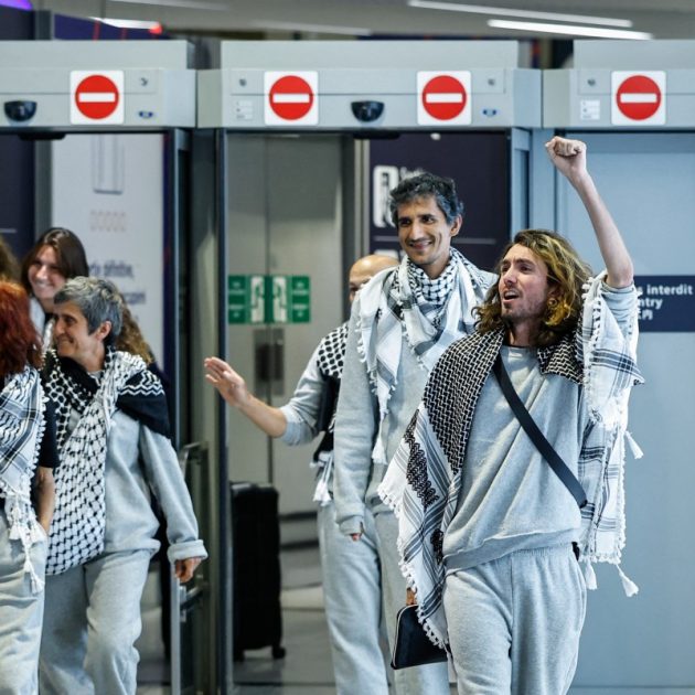 French activists detained and deported by Israel following the interception of their Gaza-bound flotilla arrive at Roissy Charles de Gaulle airport near Paris on May 22, 2026. The 37 French nationals were among some 430 activists from 40 countries aboard the Global Sumud Flotilla, intercepted by the Israeli navy in international waters on May 18 in the latest string of attempts to break the blockade of the Palestinian territory. (Photo by SIMON WOHLFAHRT / AFP)
