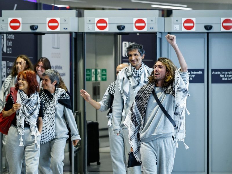 French activists detained and deported by Israel following the interception of their Gaza-bound flotilla arrive at Roissy Charles de Gaulle airport near Paris on May 22, 2026. The 37 French nationals were among some 430 activists from 40 countries aboard the Global Sumud Flotilla, intercepted by the Israeli navy in international waters on May 18 in the latest string of attempts to break the blockade of the Palestinian territory. (Photo by SIMON WOHLFAHRT / AFP)