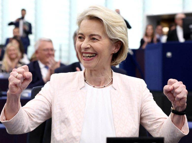 European Commission President Ursula von der Leyen celebrates after she was re-elected for a second term at The European Parliament in Strasbourg, eastern France on July 18, 2024. EU lawmakers on July 18 handed Ursula von der Leyen another five-year term as European Commission president during their first parliamentary session since June elections. Von der Leyen won with the support of 401 MEPs in the 720-seat chamber -- comfortably over the 361-vote majority she needed to remain head of the EU's executive body. There were 284 who voted against in the secret ballot. (Photo by FREDERICK FLORIN / AFP)