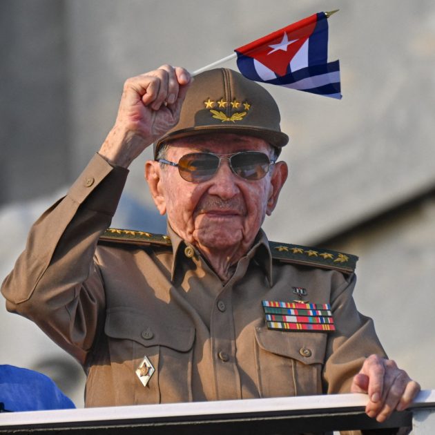 Cuba's former President Raul Castro waves a Cuban national flag during the commemoration of May Day (Labour Day), marking International Workers' Day, at Havana's Revolution Square on May 1, 2025. (Photo by YAMIL LAGE / AFP)