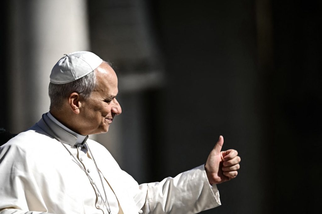 Pope Leo XIV does a thumb up towards the faithfuls as he arrives on the Pope-mobile in St Peter's Square at the Vatican, prior to lead his weekly general audience on April 29, 2026. (Photo by Filippo MONTEFORTE / AFP)