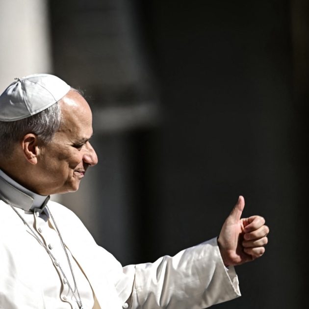 Pope Leo XIV does a thumb up towards the faithfuls as he arrives on the Pope-mobile in St Peter's Square at the Vatican, prior to lead his weekly general audience on April 29, 2026. (Photo by Filippo MONTEFORTE / AFP)