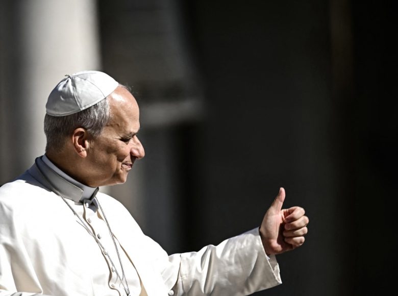 Pope Leo XIV does a thumb up towards the faithfuls as he arrives on the Pope-mobile in St Peter's Square at the Vatican, prior to lead his weekly general audience on April 29, 2026. (Photo by Filippo MONTEFORTE / AFP)