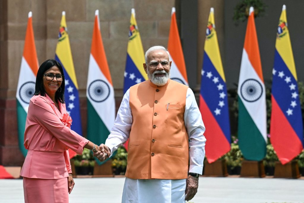 Venezuela's interim President Delcy Rodriguez (L) shakes hands with India's Prime Minister Narendra Modi before their meeting at the Hyderabad House in New Delhi on June 4, 2026. (Photo by Arun SANKAR / AFP)