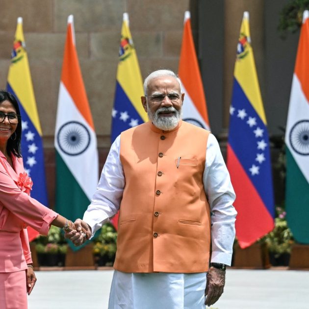 Venezuela's interim President Delcy Rodriguez (L) shakes hands with India's Prime Minister Narendra Modi before their meeting at the Hyderabad House in New Delhi on June 4, 2026. (Photo by Arun SANKAR / AFP)
