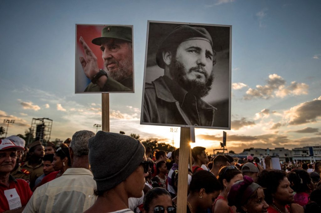 People gather before the start of the last ceremony to pay homage to the late Cuban leader Fidel Castro in Santiago, Cuba on December 3, 2016. The convoy carrying the ashes of Cuba's late leader Fidel Castro ends an island-wide journey in the cradle of his revolution for a big ceremony before his burial. (Photo by JUAN BARRETO / AFP)