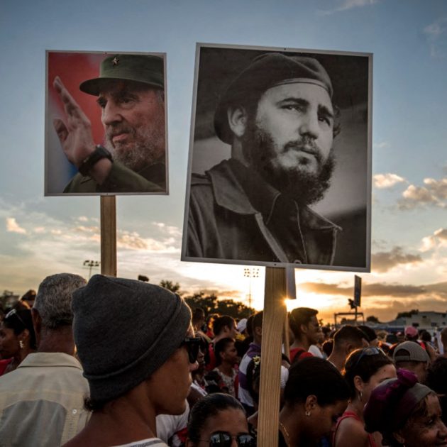 People gather before the start of the last ceremony to pay homage to the late Cuban leader Fidel Castro in Santiago, Cuba on December 3, 2016. The convoy carrying the ashes of Cuba's late leader Fidel Castro ends an island-wide journey in the cradle of his revolution for a big ceremony before his burial. (Photo by JUAN BARRETO / AFP)