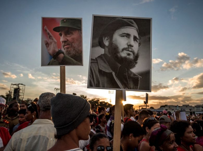 People gather before the start of the last ceremony to pay homage to the late Cuban leader Fidel Castro in Santiago, Cuba on December 3, 2016. The convoy carrying the ashes of Cuba's late leader Fidel Castro ends an island-wide journey in the cradle of his revolution for a big ceremony before his burial. (Photo by JUAN BARRETO / AFP)
